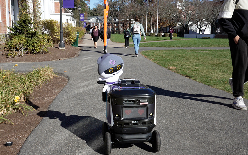 Kiwibot and Alex go for a ride around the academic quad