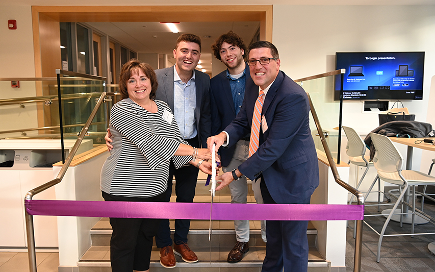 Scott Samson '91 and Family Cut Ribbon at 24/7 Study Lounge Dedication