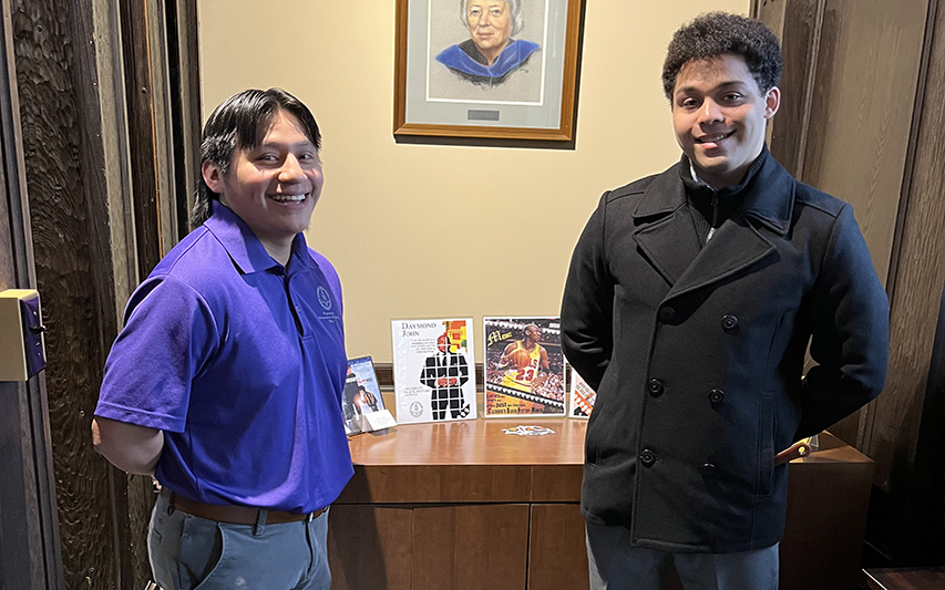 Jackson Greeno and Anthony Aiken, PAL Ambassadors, Pose Next to Black History Month Exhibit