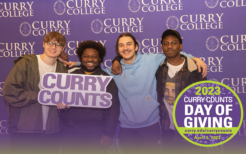 Students Pose with Curry Counts Foam Sign on Day of Giving