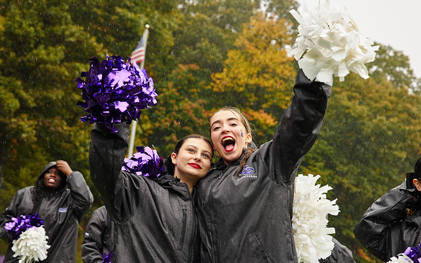Despite the Rainy Autumn Weather at Homecoming and Family Weekend 2023, the Cheer Team is All Smiles
