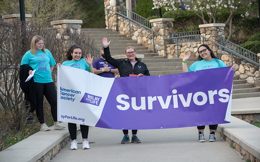 Relay for Life Survivors Pose with Banner