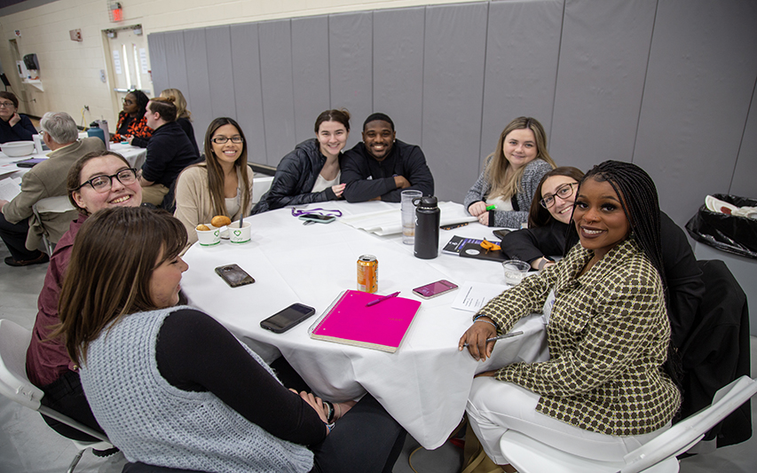 Students Pose at Lunch During Leadership Conference
