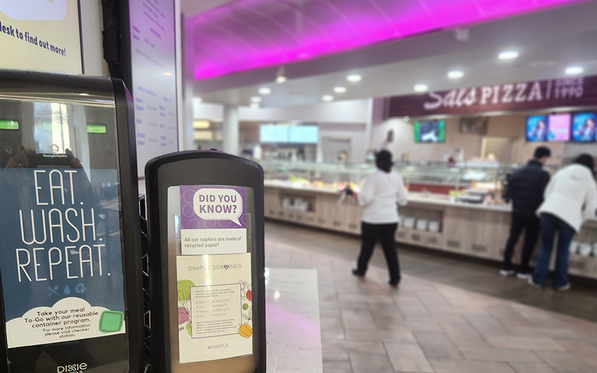 Curry College Dining Marketplace signage promoting sustainability efforts