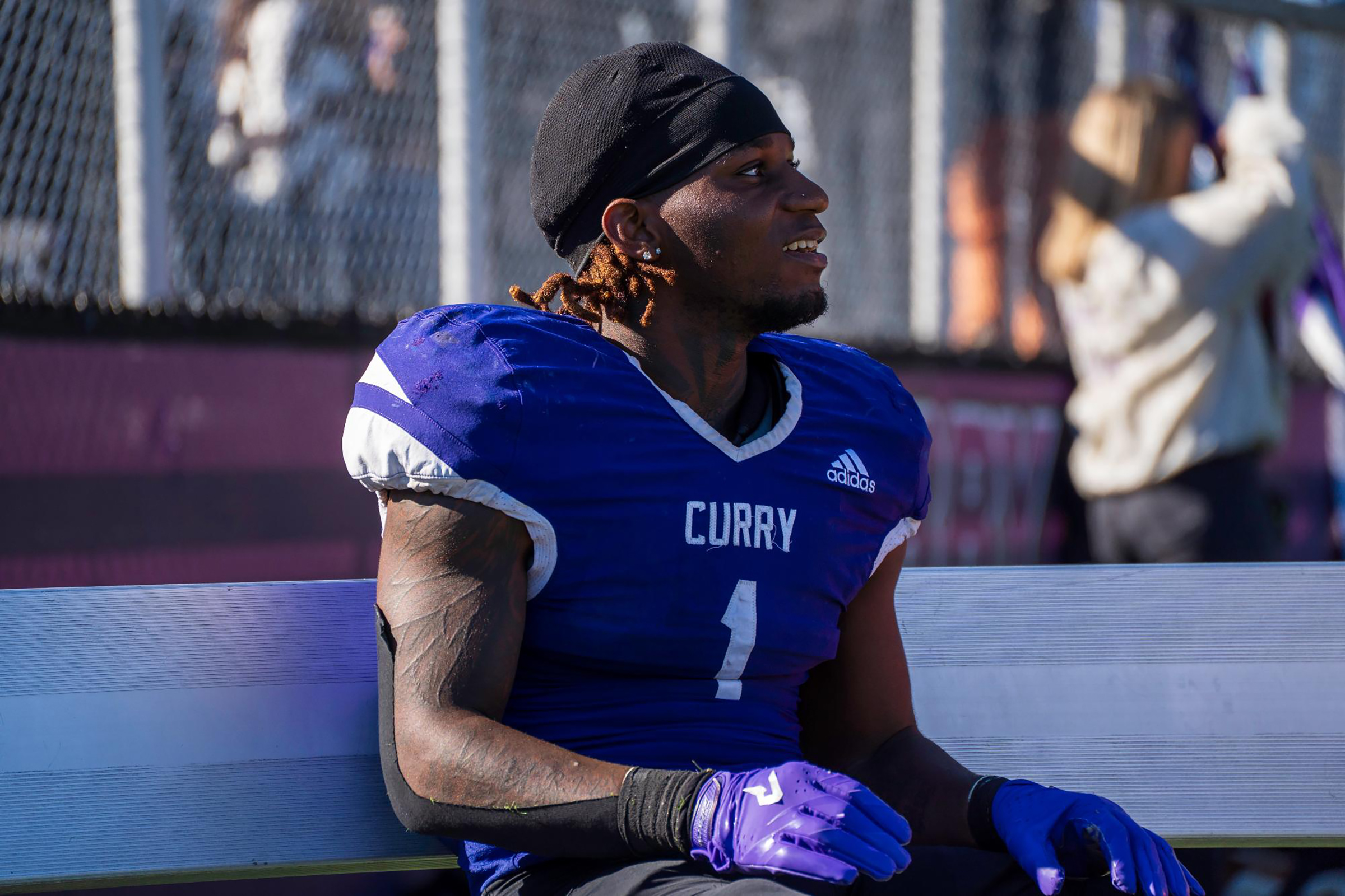 Montie Quinn Smiles on the sidelines after an amazing game