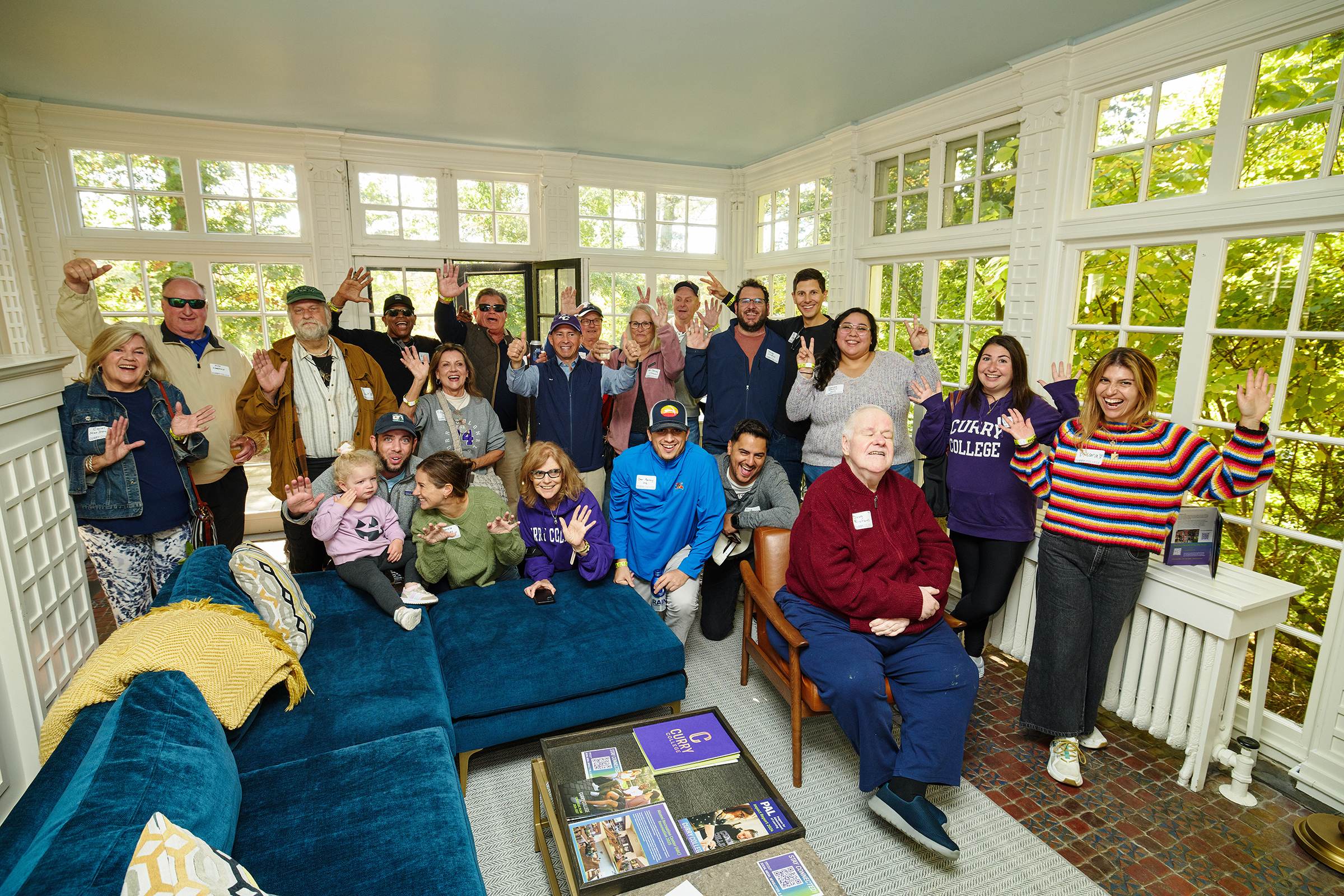 Classes of 2015, 2000, and 1975 pose for a group shot inside the President's Residence during Reunion Brunch