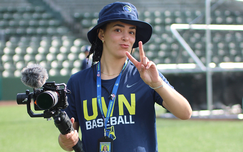 Margot Oxford Poses at her internship with her camera and gimble