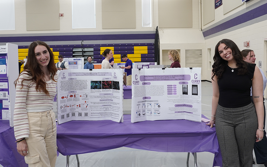 Students pose with presentations at forum