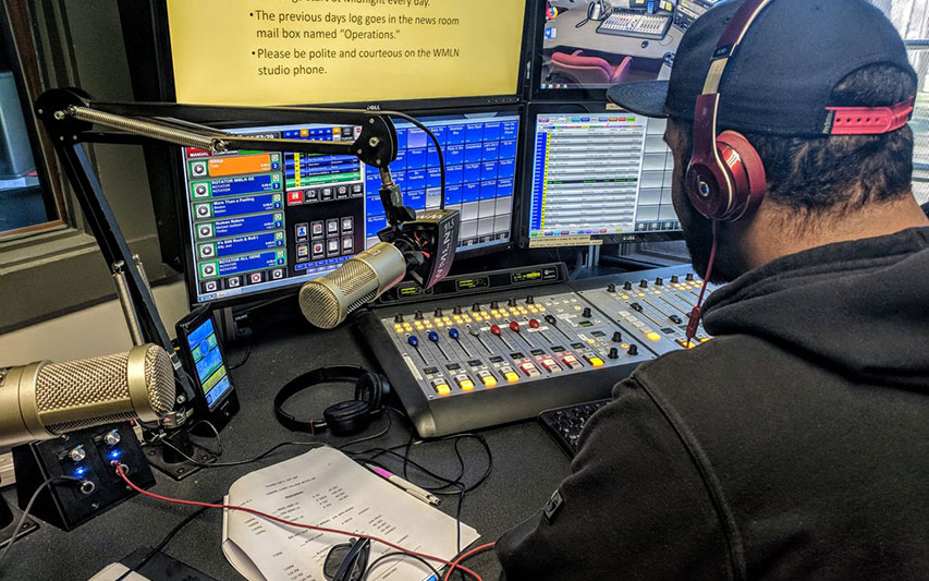 Communication student Garrett Riley, Class of 2018, broadcasts to listeners over a 40-mile radius as a WMLN-FM DJ.