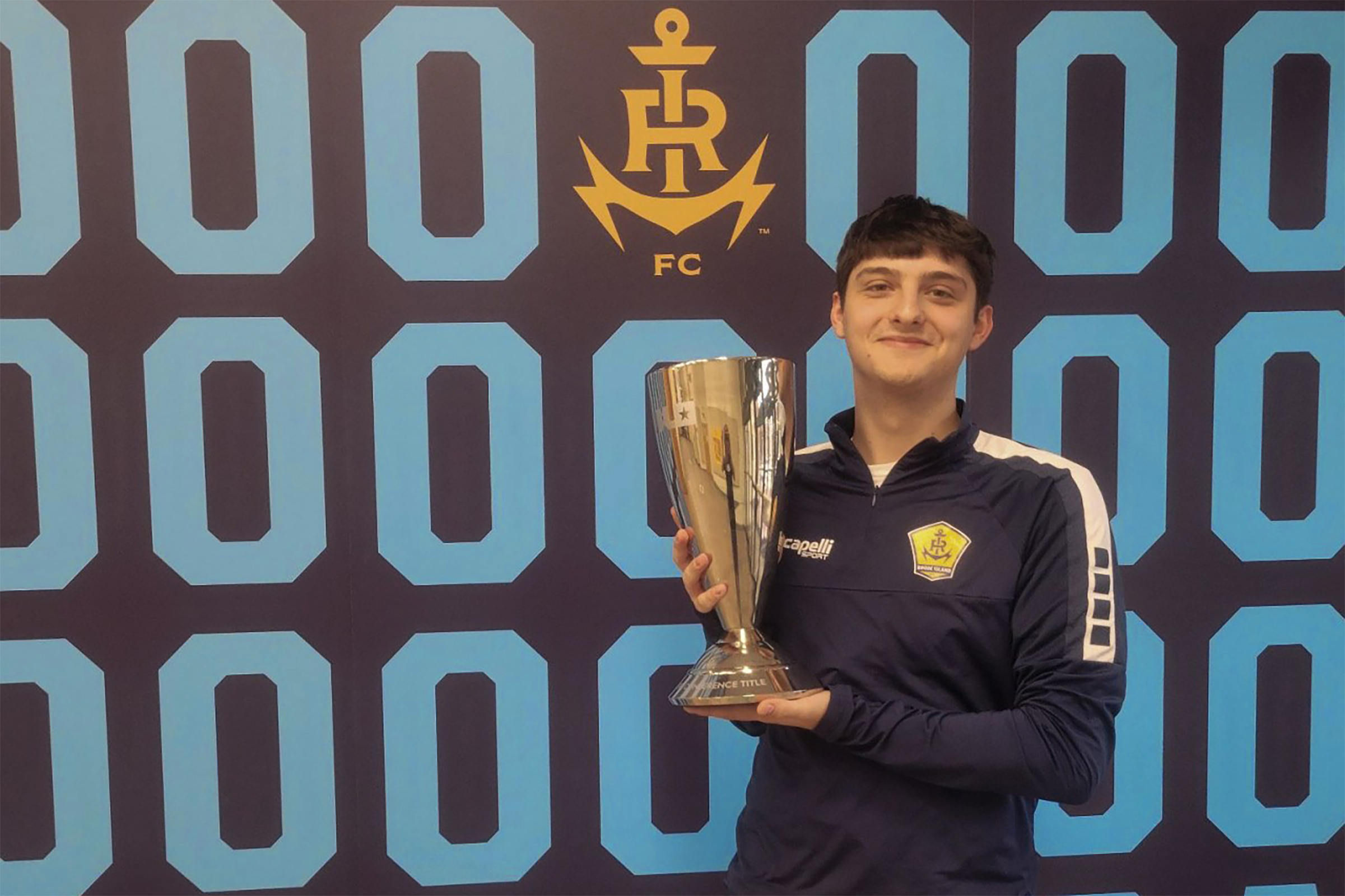 Adam poses with USL Finalist trophy