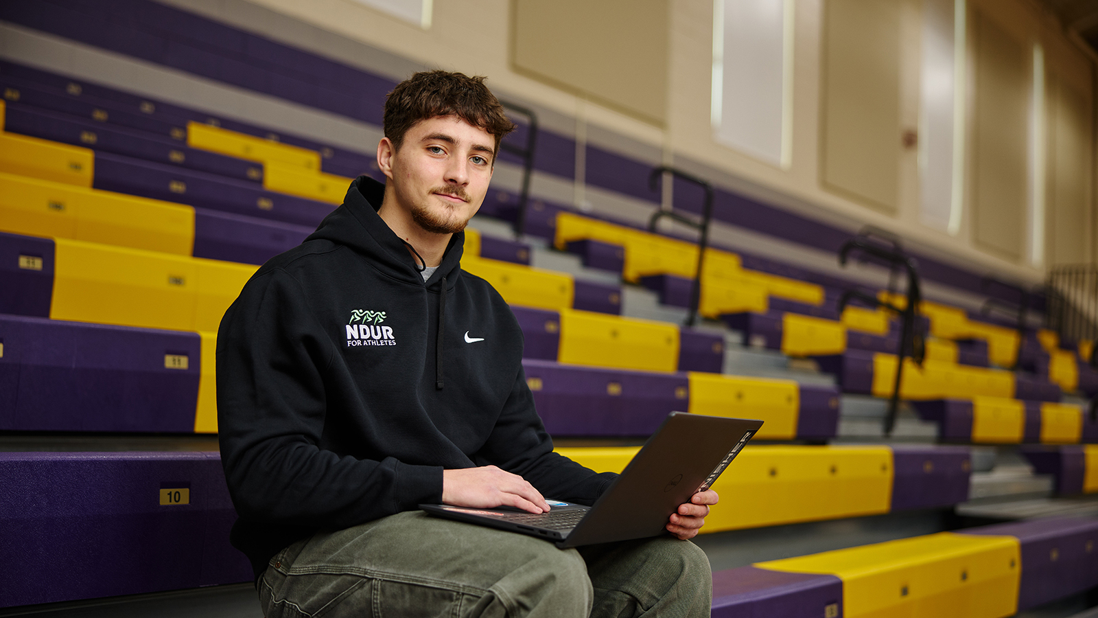 Brendan Cunningham sits in Katz Gym