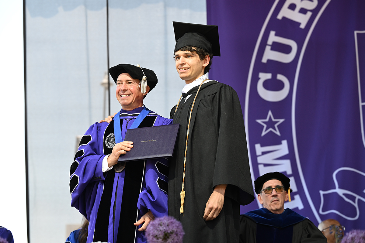 President Gonzalez poses with student