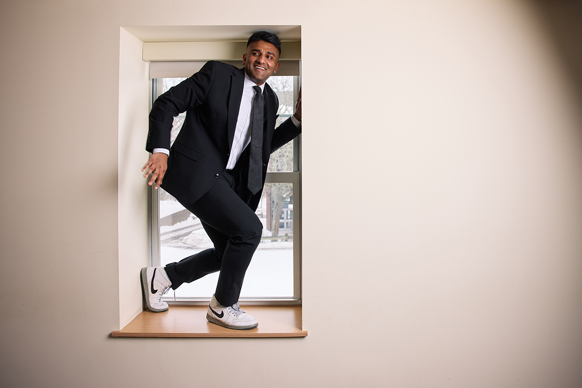 Dr. Mashuk Rahman posing inside a window in the classroom
