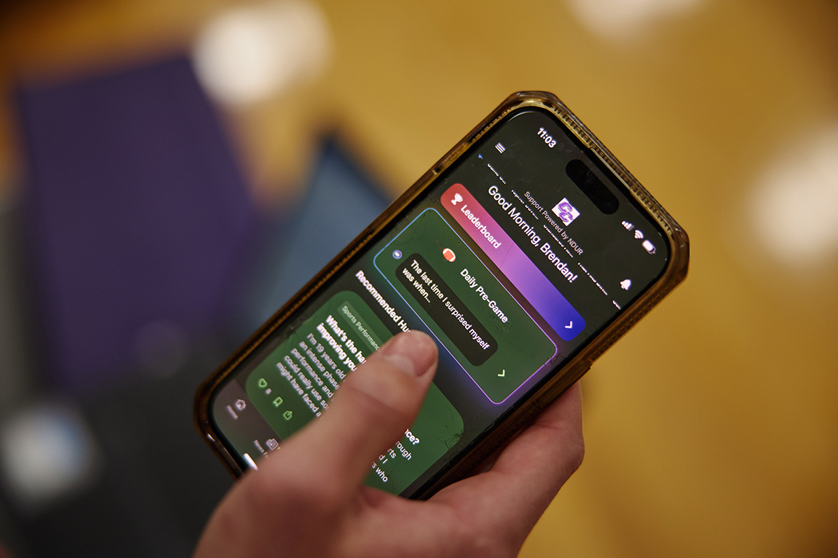 cell phone shows NDUR app interface