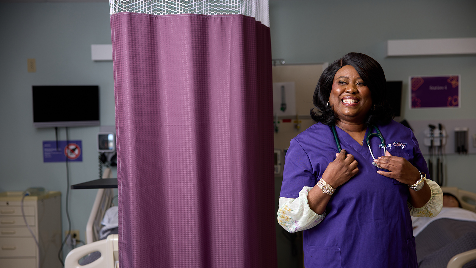 Racquel Rose Poses in Scrubs in Nursing Sim Lab