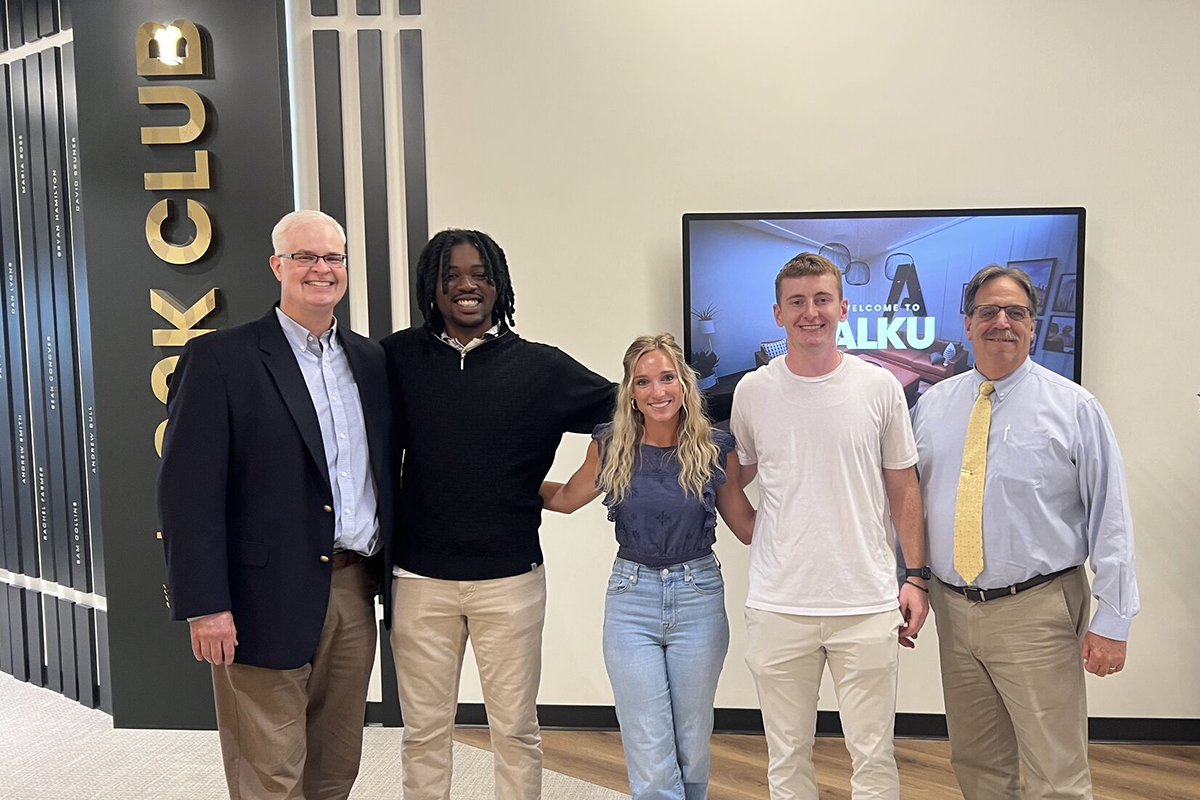 Dr. Danielle Allen poses for a picture with Curry College President's Leadership Program students