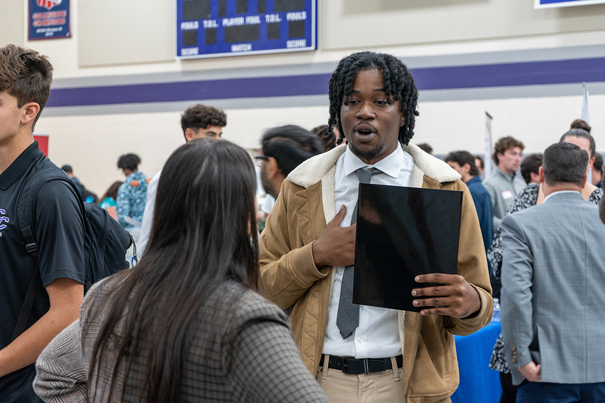 Roshaine engages in job fair