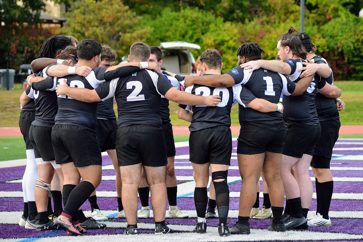 Rugby players in pre-game huddle