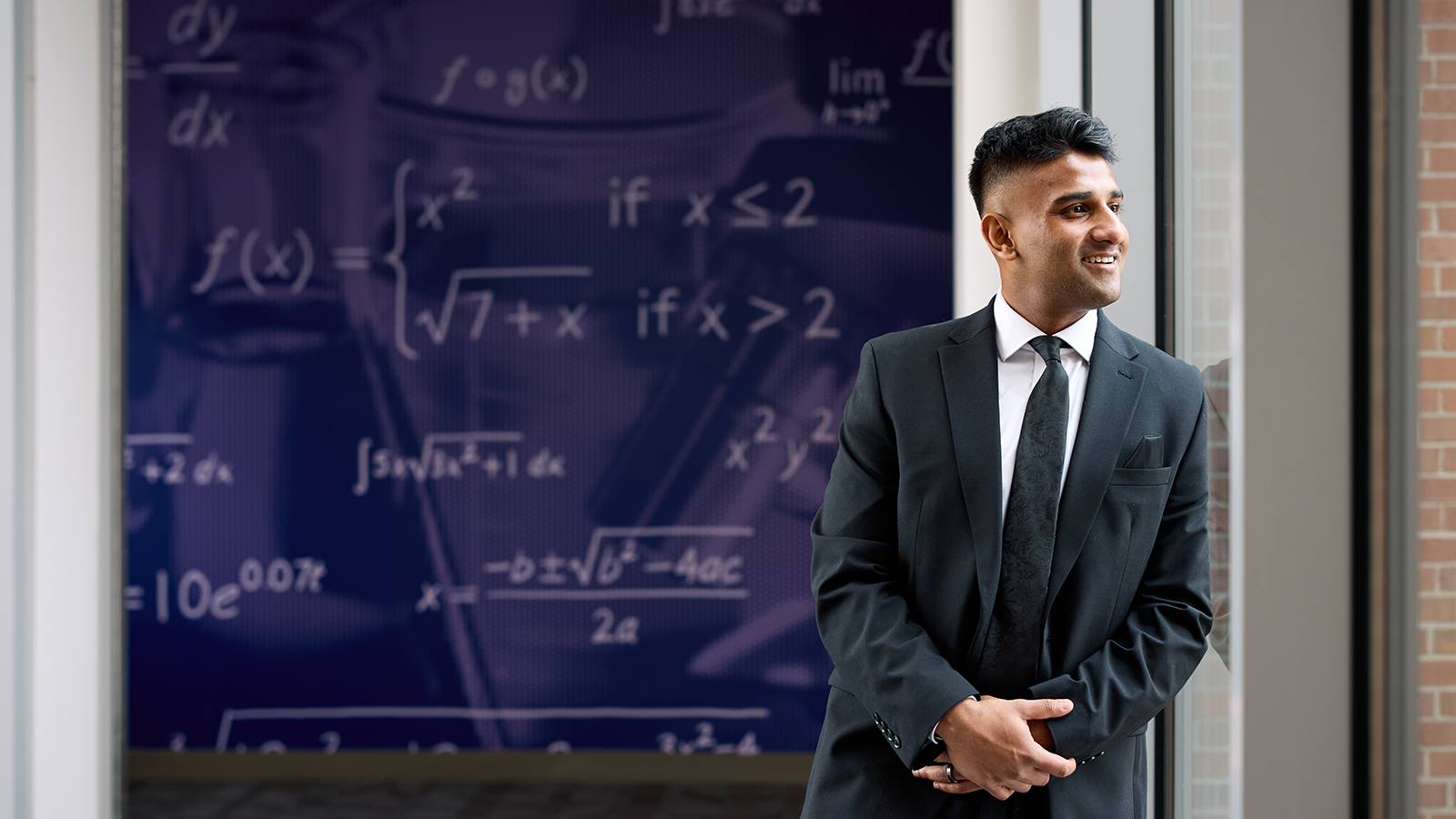 Dr. Mashuk Rahman poses inside the Learning Commons