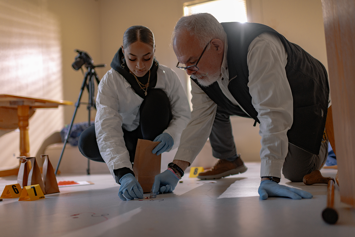 Nakayla with her professor in the forensics lab