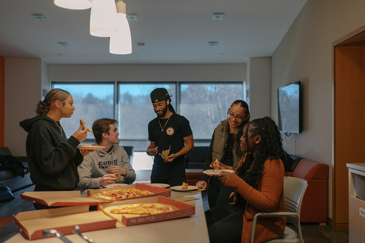 Gio and Nakayla having pizza with friends