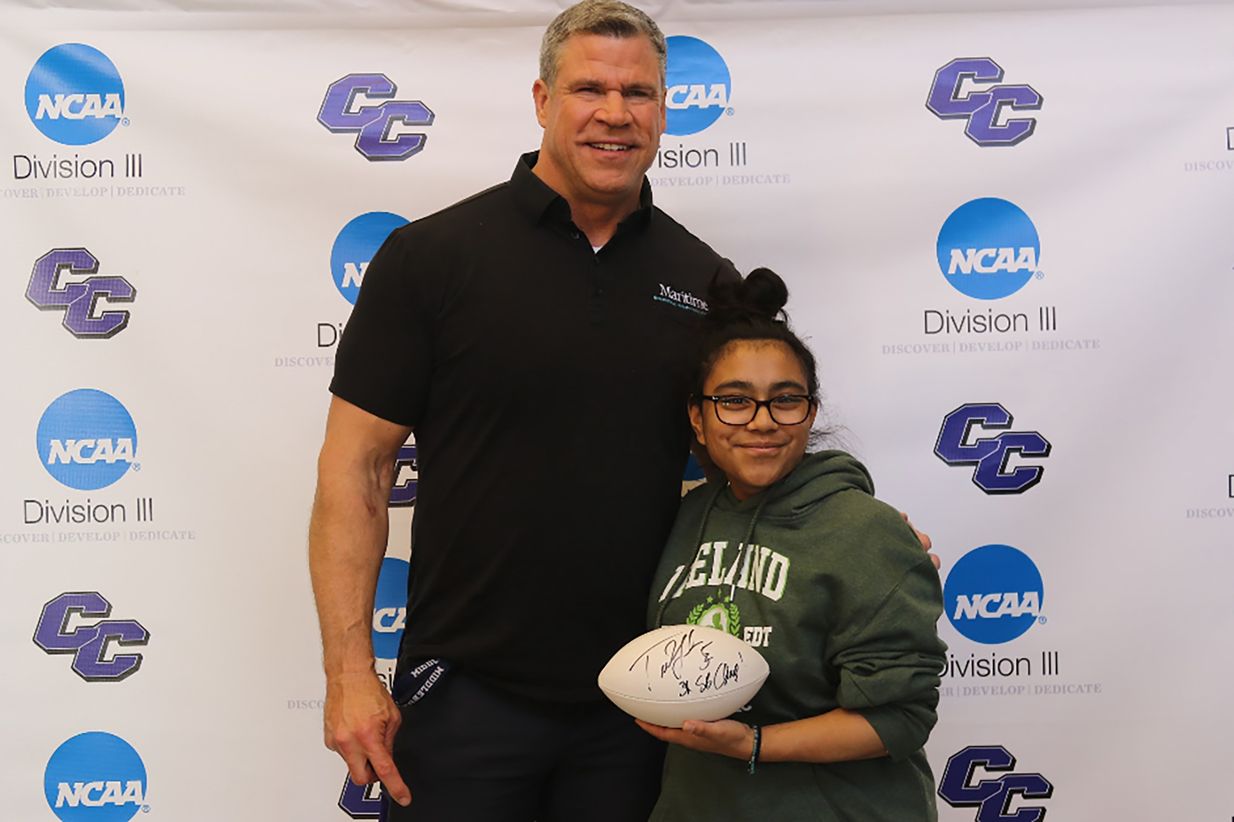 Ted Johnson poses with student