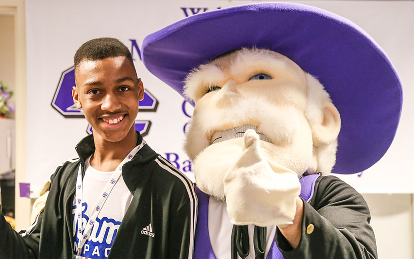 Malachi Harris with Curry Colonels mascot