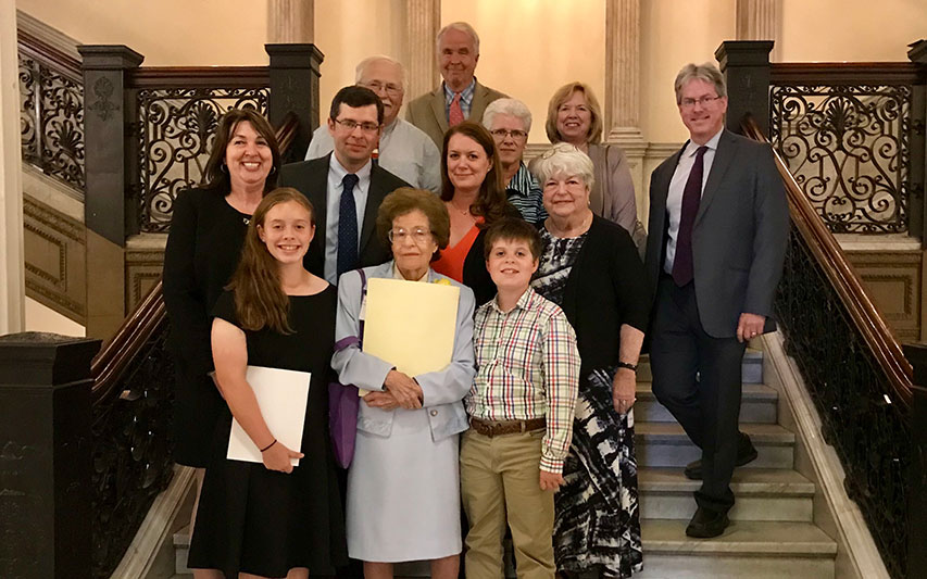 Politics and History Professor Hazel Varella celebrates with friends, colleagues, and family members at the State House.