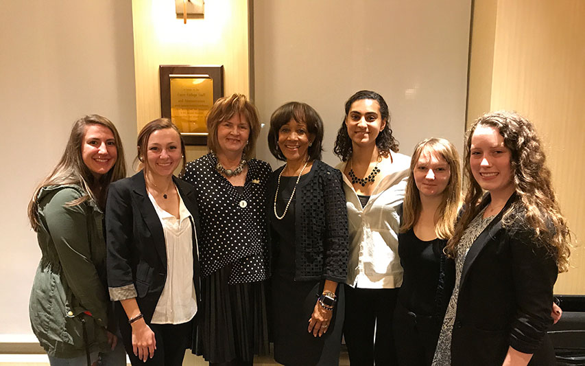 Trustee Joyce A. Murphy, Hon. '99, MPA and Dr. Deborah C. Jackson, Hon. '14 with students.