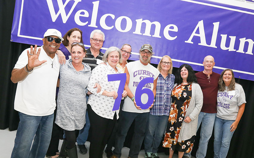 Class of 1976 Alumni pose for a phot at Homecoming and Family Weekend