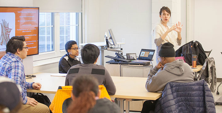 Curry College students and faculty in a Learning Commons classroom