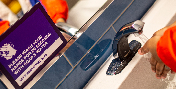 Curry College Student washing hands