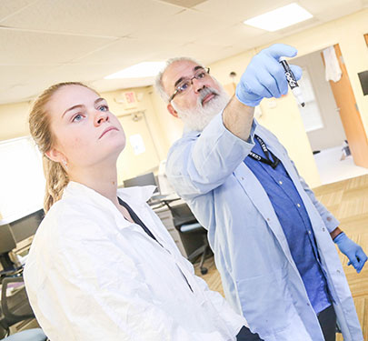 Prof. Jim Jabbour with forensics student