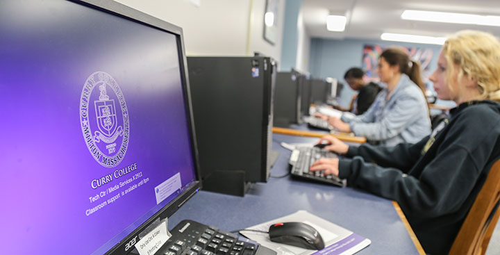 Students at computers in the Levin Library at Curry College