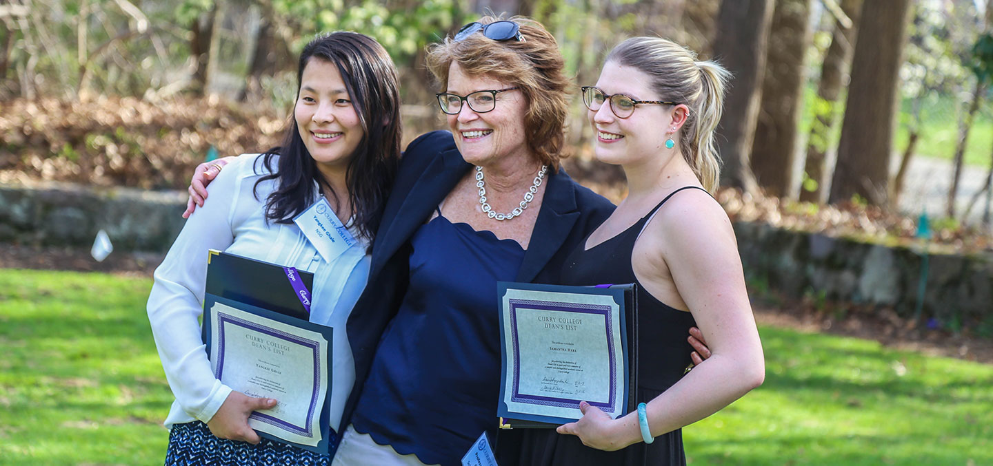 Student Dean's List members pose with their professor