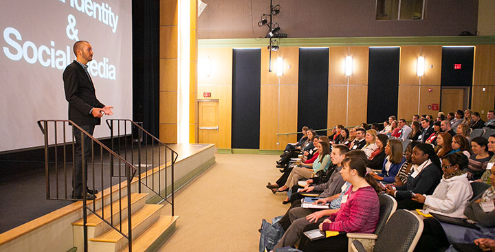 The keynote speaker presents at the Curry College Center for Career Development Senior Conference event