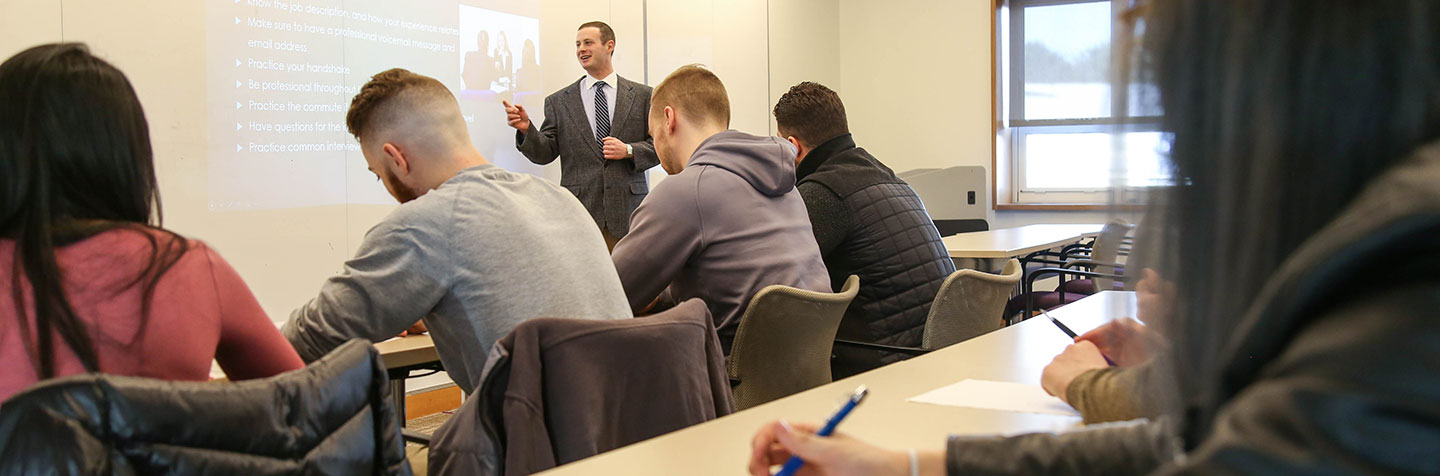 A Curry College Center for Career Development staff member gives students an experiential education lesson