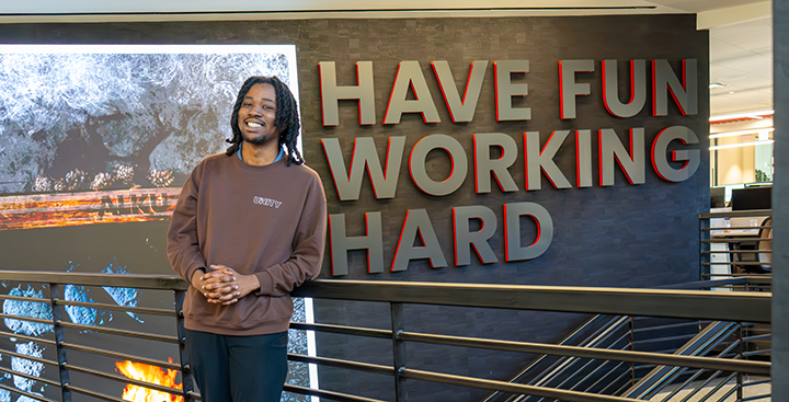 A Curry College student interns at Alku