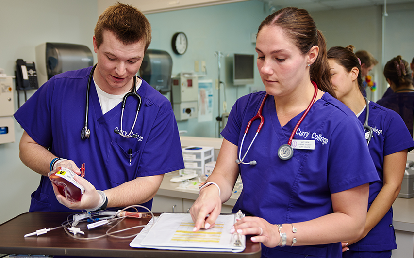 Nursing students collaborate in the SIM Lab at Curry College