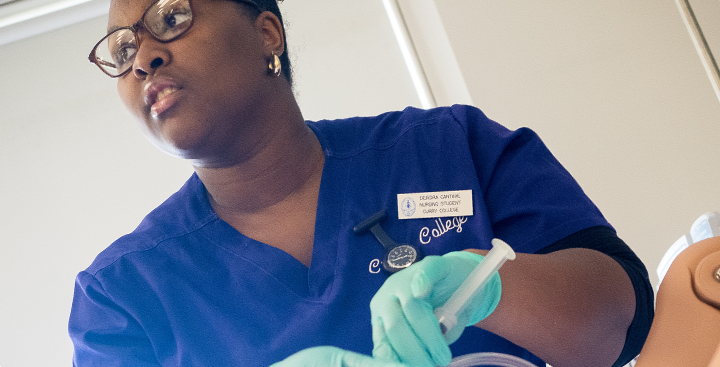 A Curry nurse works in a simulation lab