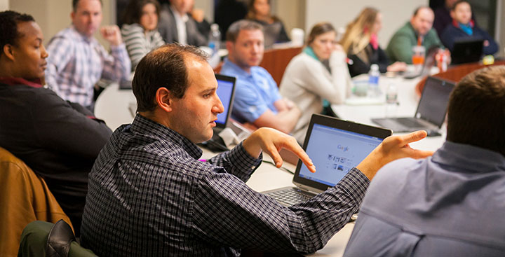 Curry College Admission and Aid is represented by continuing education students in a class discussion