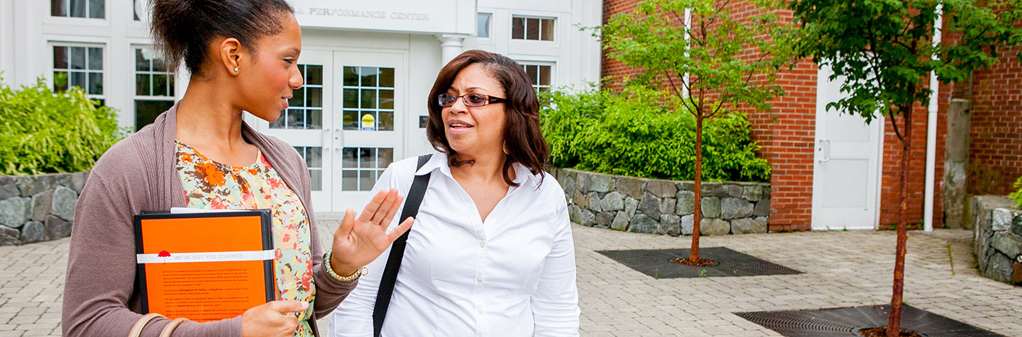 Students walking on campus pursuing a Continuing Education Bachelor's Degree at Curry College