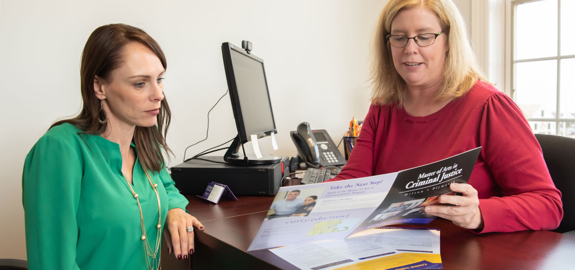 A Transfer Student is advised by a Curry College staff member