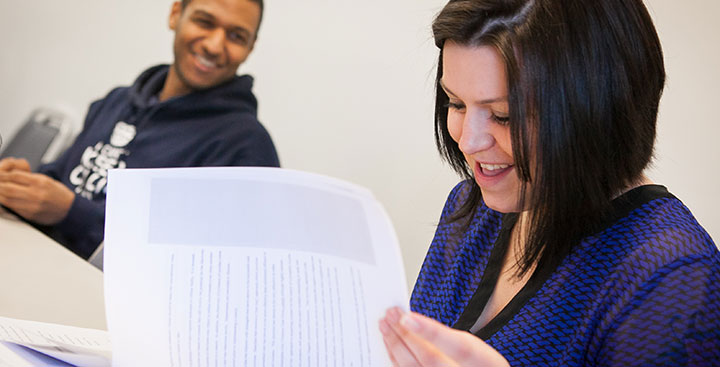 Curry College certificate program students in class smiling