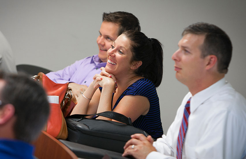 Curry College continuing education students in class engaged in a course geared toward corporate education