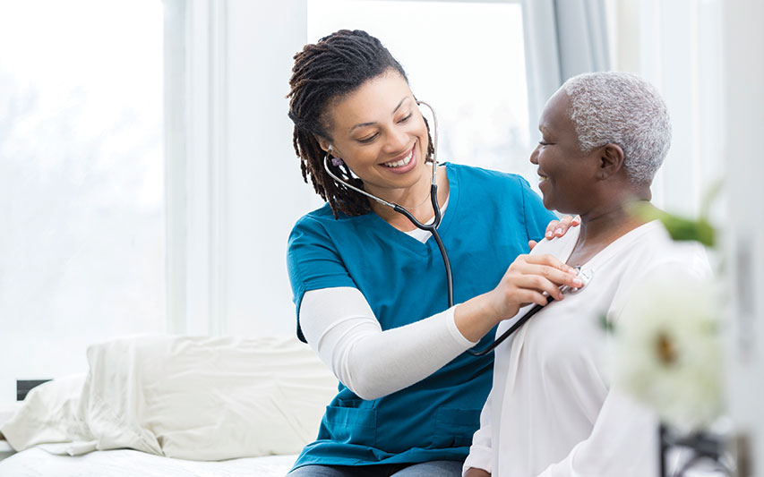 A nurse tends to a patient