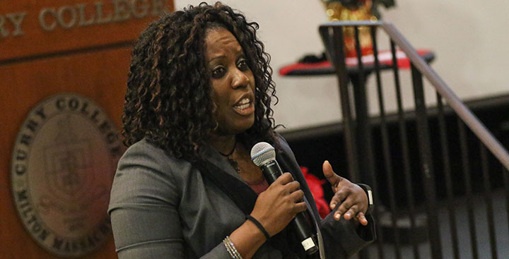 A Curry College Master of Business Administration (MBA) student speaks in class representing the Leadership Degree