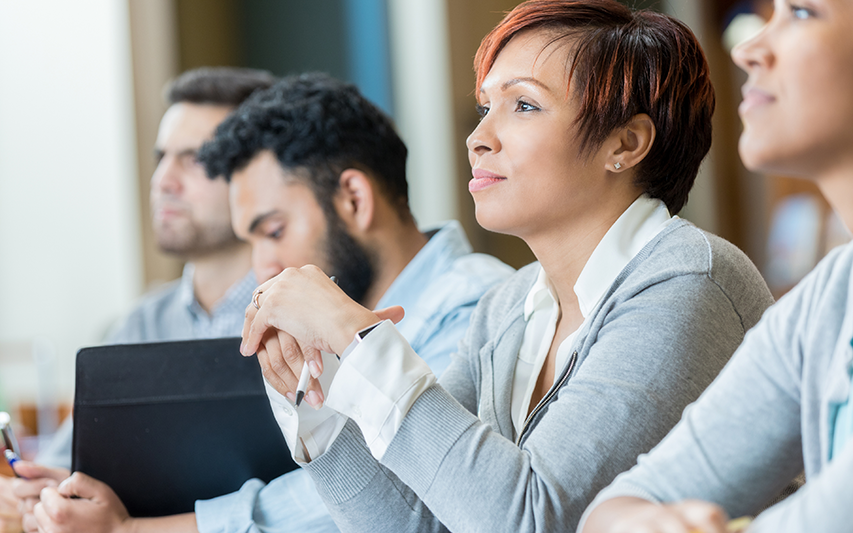 MBA students listen to a class lecture