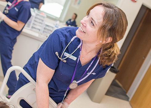 A Curry College ACCEL nursing student in the SIM Lab