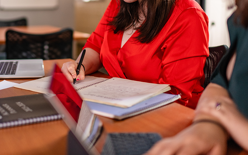 A student and professor discuss an assignment